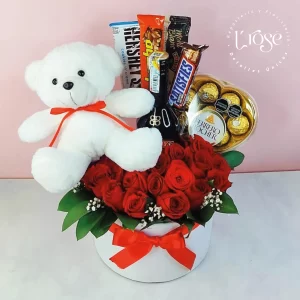 #538 Caja cilindro con rosas, peluche, chocolates y licor