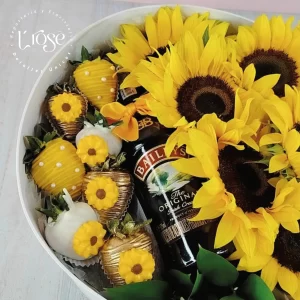 #186 Caja redonda con girasoles, fresas con chocolate y Media de Baileys