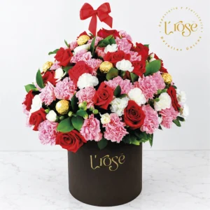 #292 Caja cilindro con 24 rosas, clavel, clavellina, chocolates y globo burbuja