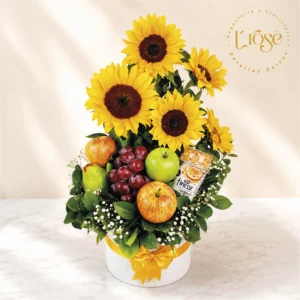 #425 Caja cilindro con girasoles, frutas y Bonyurt