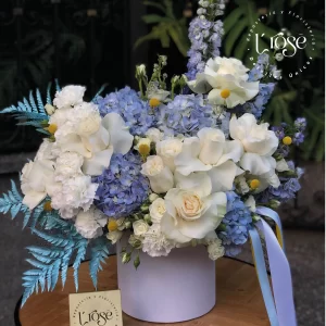 #558 Caja cilindro con flores